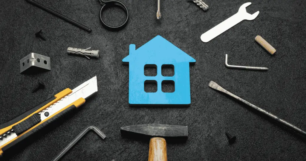 Outline of a home surrounded by tools