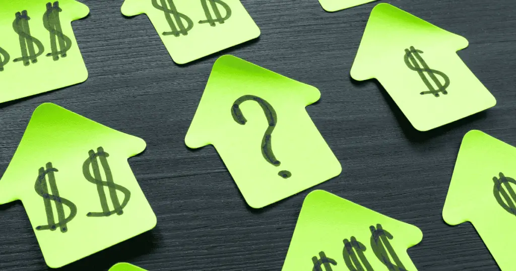 sticky notes in the shape of houses with dollar signs on them