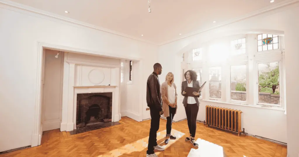 Realtor showing a home to a couple