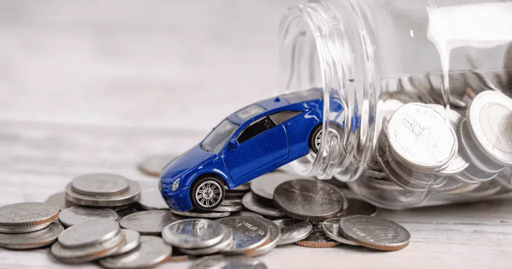 toy car coming out of a jar full of coins