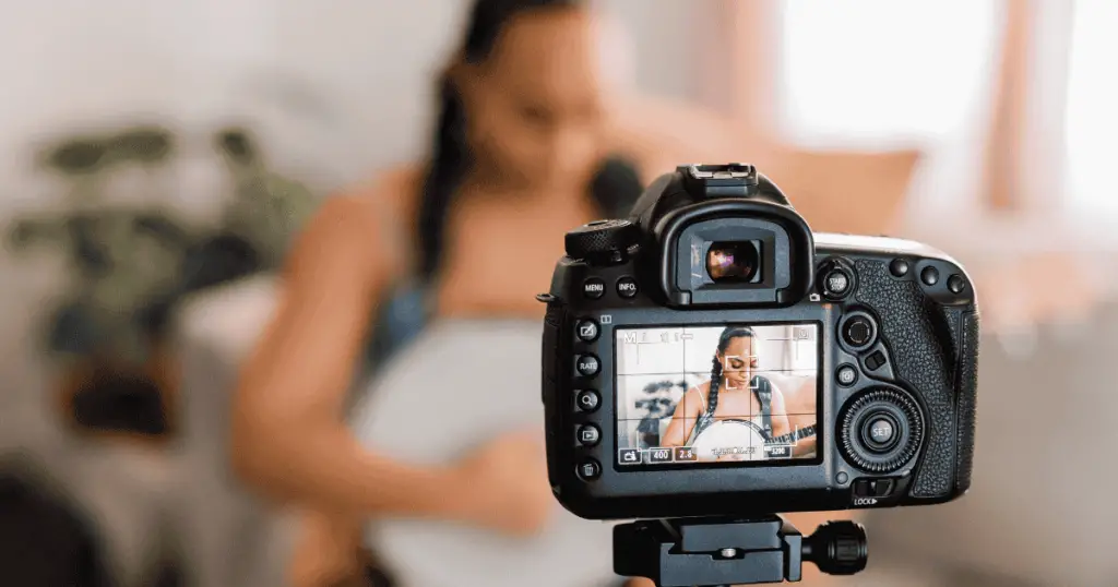 Person being filmed by a camera