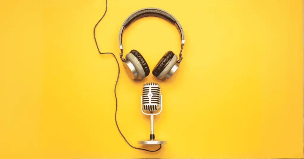 Headphones and a microphone with a yellow background