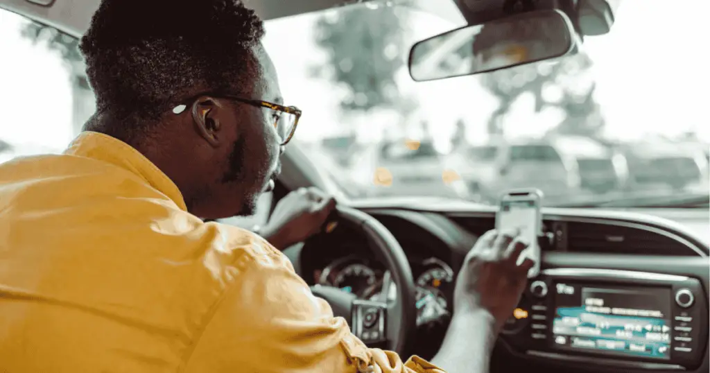 Person driving while using a rideshare app